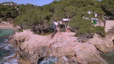 explore the stunning coastal landscape of cala rajada, mallorca. enjoy the rocky shores, serene waters, and lush greenery surrounding this beautiful area near cala gat.