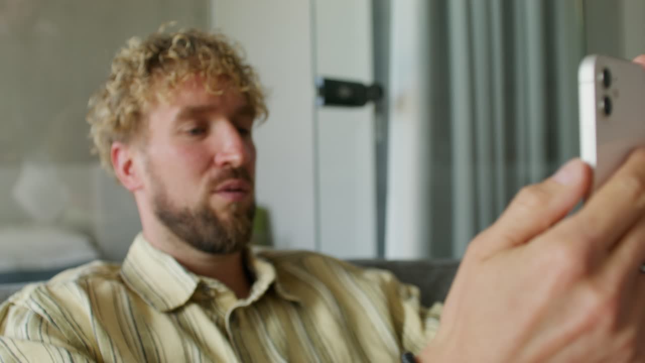 Man using smartphone for video call