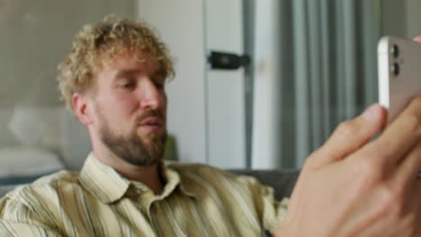 man using smartphone for video call