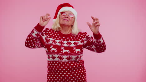 Senior-Christmas-grandmother-woman-with-deer-antlers-listening-music,-dancing-disco,-fooling-around