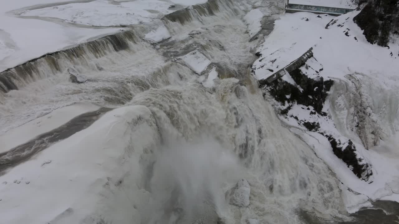 Majestic Waterfalls Flowing Into Frosted Rocks At Chaudiere Falls Park In Levis, Quebec Canada