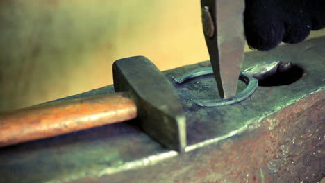 iron horse horseshoe lie on anvil. blacksmith making metal horseshoe