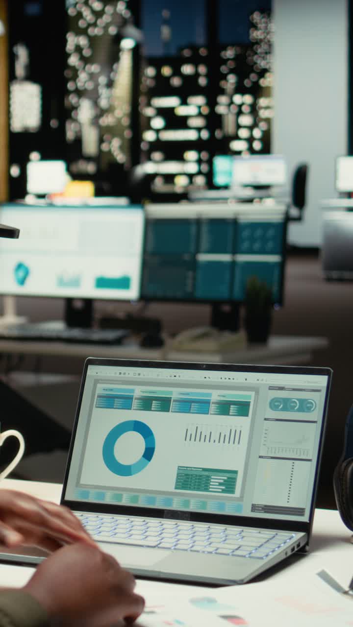 Vertical Video African american person documenting numbers and finance metrics