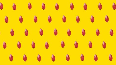 animación de múltiples hojas rojas de otoño sobre fondo amarillo