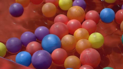 colourful plastic balls in blow up pool