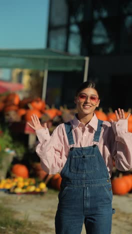 young woman in pumpkin patch