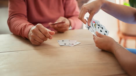 Nursing-home,-hands-and-playing-cards-by-nurse