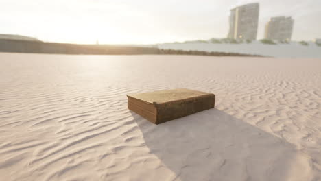 old-book-on-the-sand-beach