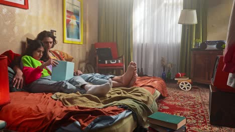 couple relaxing and reading in a cozy retro bedroom
