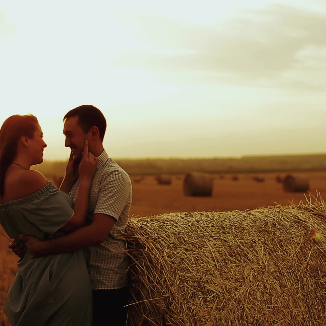 Couple on harvested field