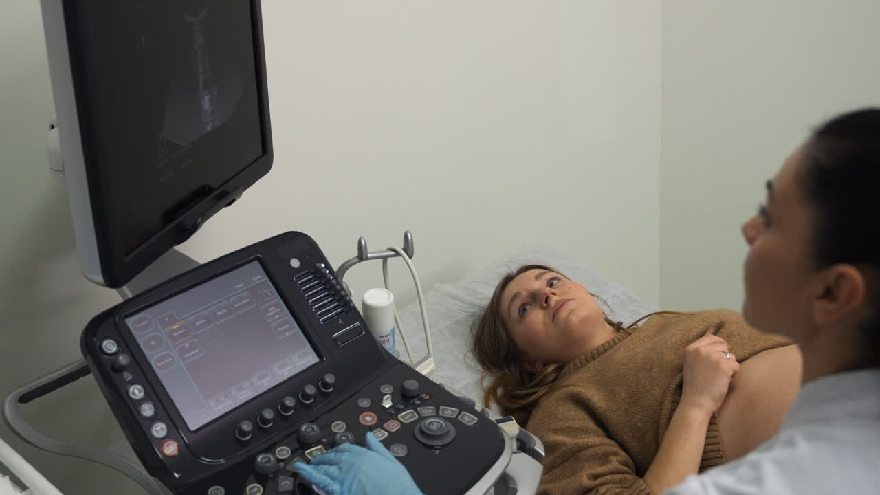Pregnant woman laying on stretcher