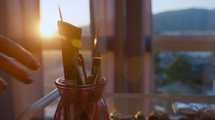 Paint Brushes and Sunset View