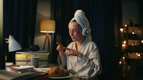 Festive-person-dancing-home-closeup.-Excited-woman-enjoying-computer-evening