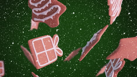 animation of christmas gingerbread cookies over snowflakes falling on green background