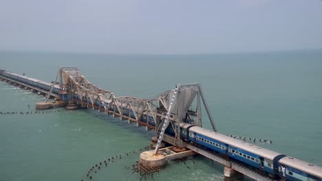 train crossing vintage old bridge over sea from top angle video taken at pamban bridge rameswaram tamilnadu india.