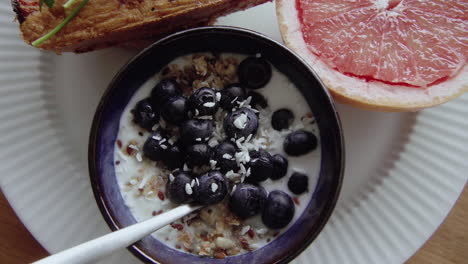 close up top shot of healthy breakfast plate beautifully served and decorated on white plate