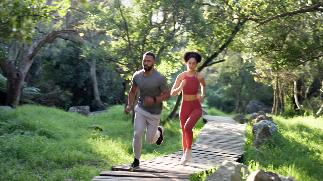 Running, fitness and couple of friends in forest