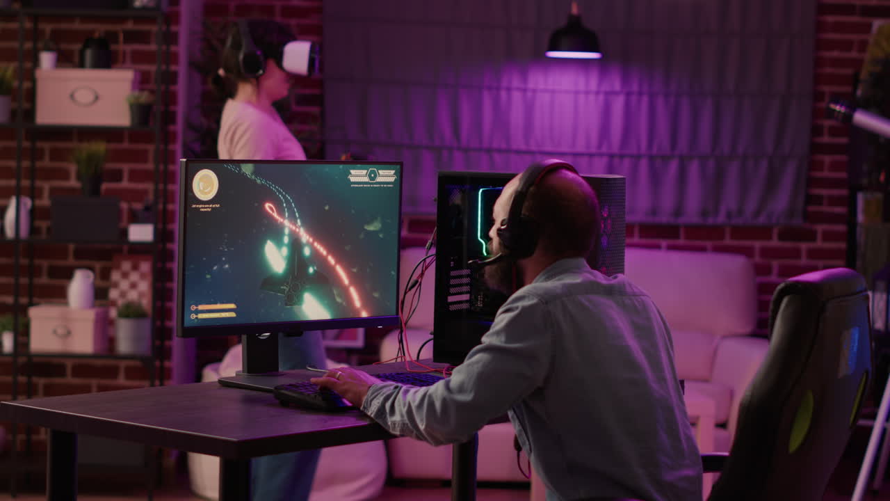 Gamer playing multiplayer space shooter while gaming girl is fighting in virtual reality game
