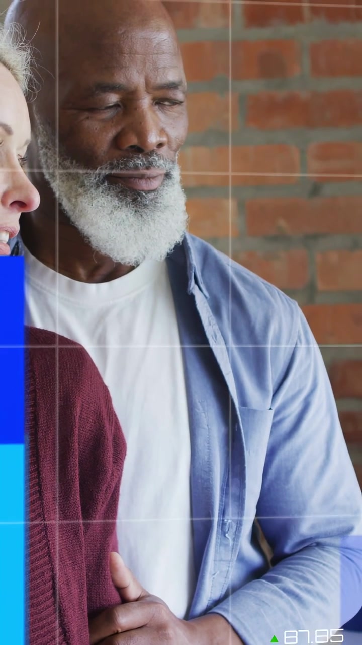 Vertical video: On feed, couple on brick wall seeing bars and line overlaying torsos for finance