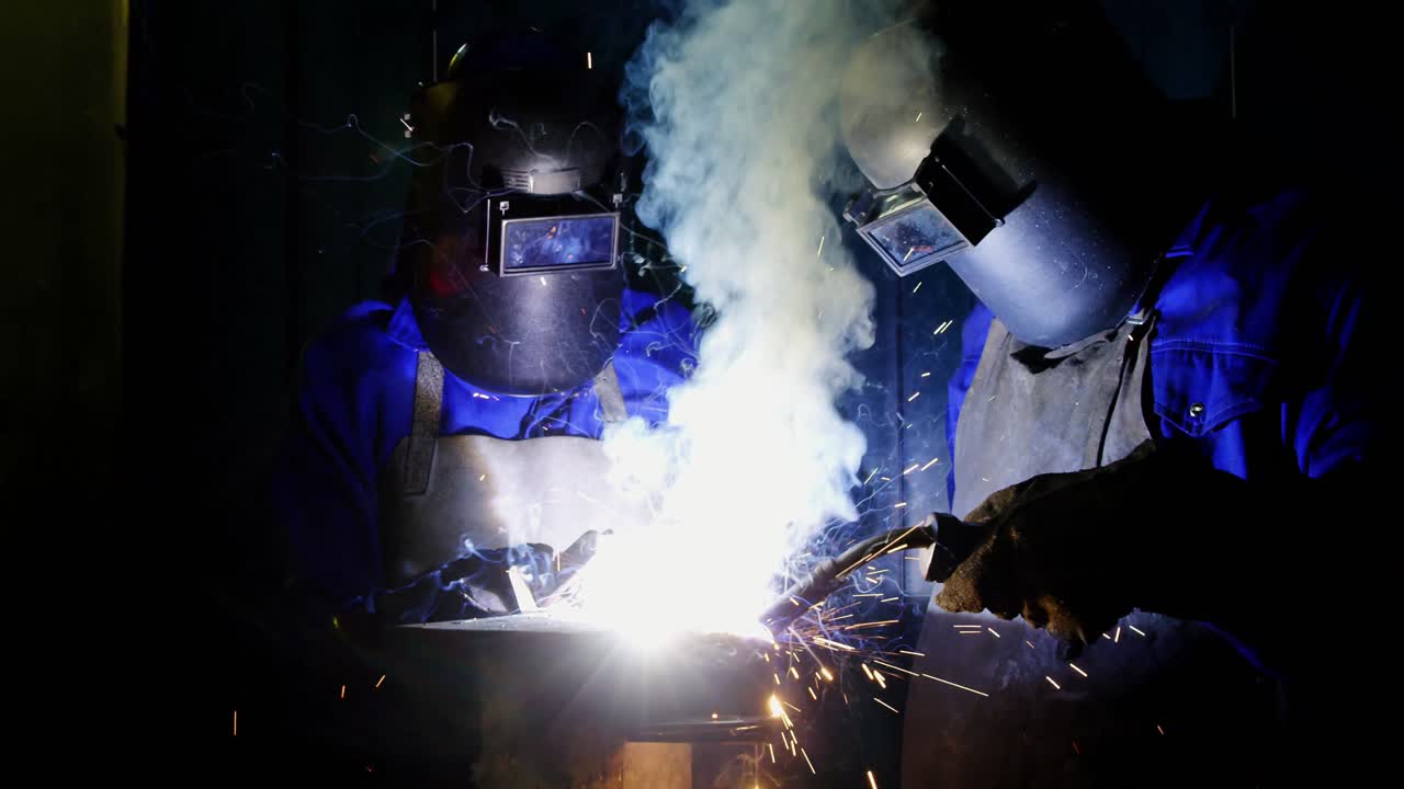 Welders welding a metal