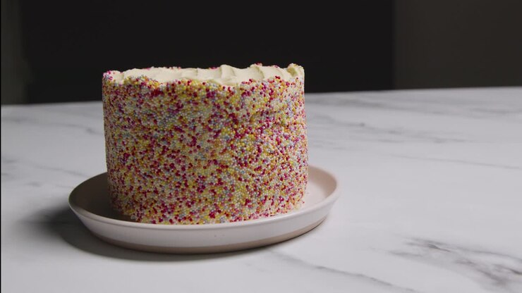 Studio Shot Of Birthday Cake Covered With Hundreds And Thousands Decorations 10