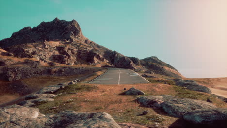 scenic view of empty road amidst volcanic landscape