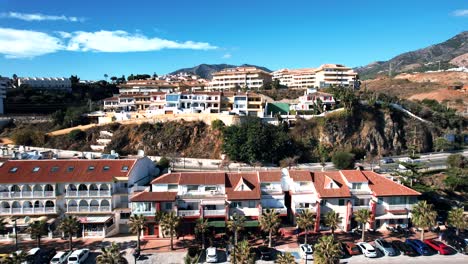 Aerial-plan-of-coastal-town-condos-and-luxury-homes-on-sunny-day