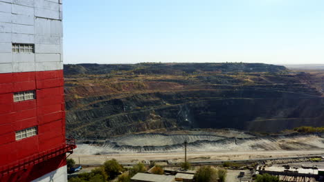 open pit mine with industrial tower