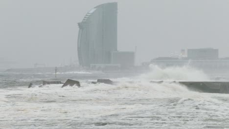 surge with big waves, strong wind and poor visibility. slow motion.