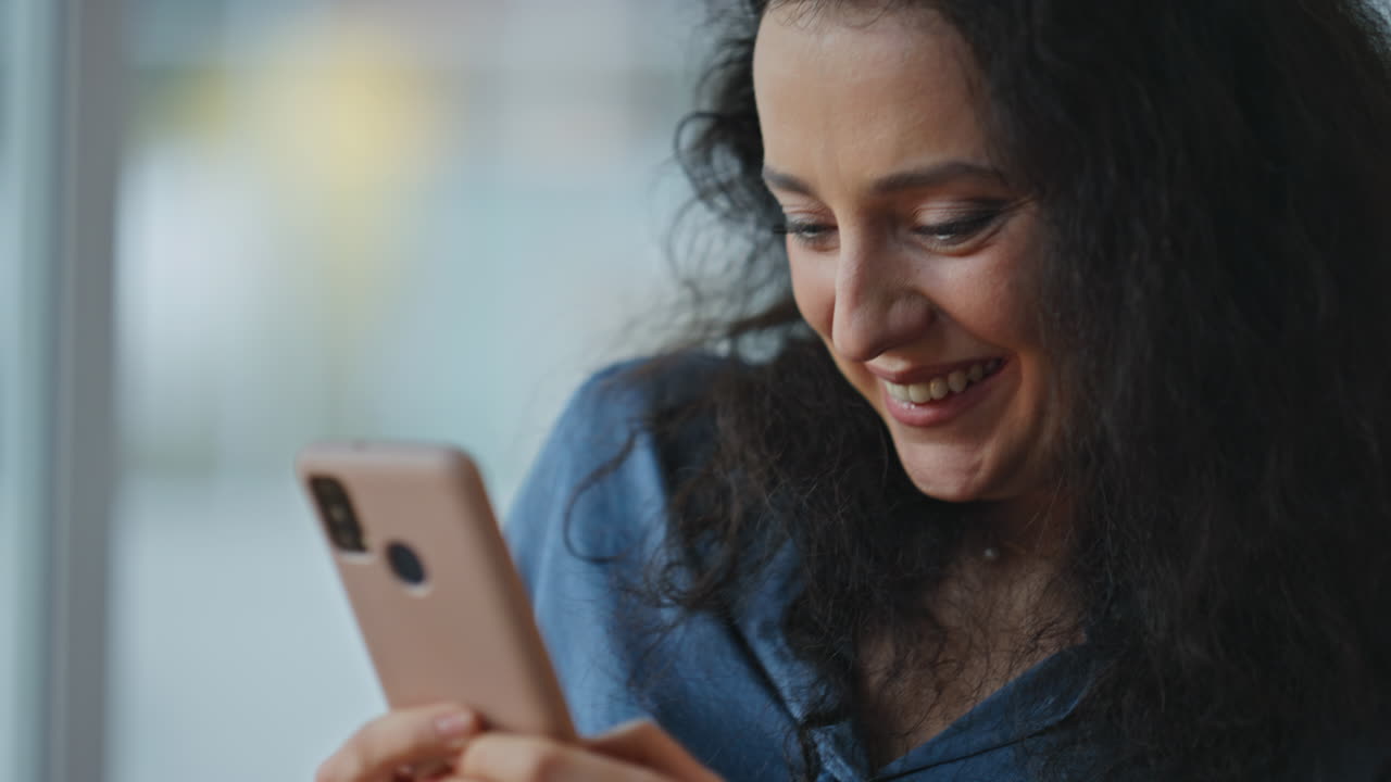 Fingers texting smartphone device closeup. Joyful woman enjoying communication