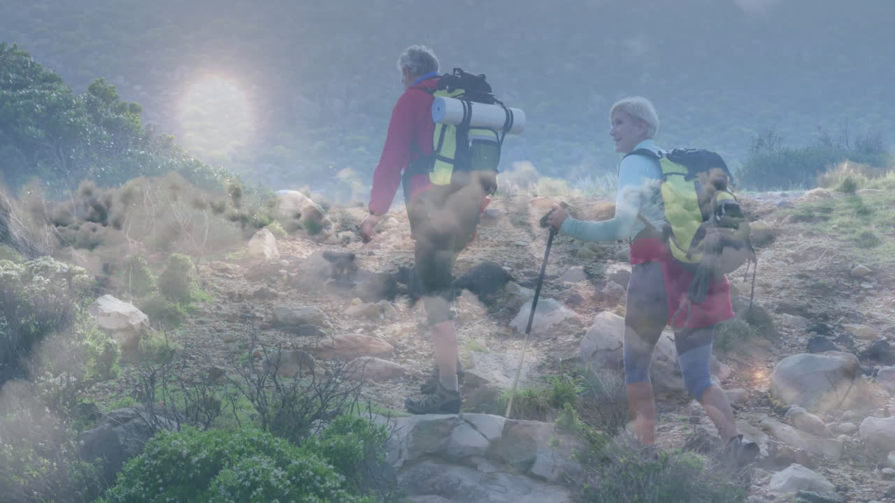 man leading woman hiking uphill on rocky trail, showing health graph and pulse icon