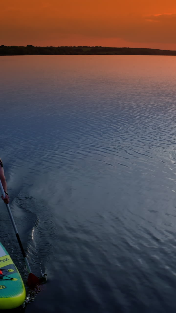 Young Man SUP Boarding