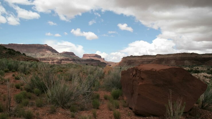 Storm clouds move over the desert of Mexican Hat Canyon