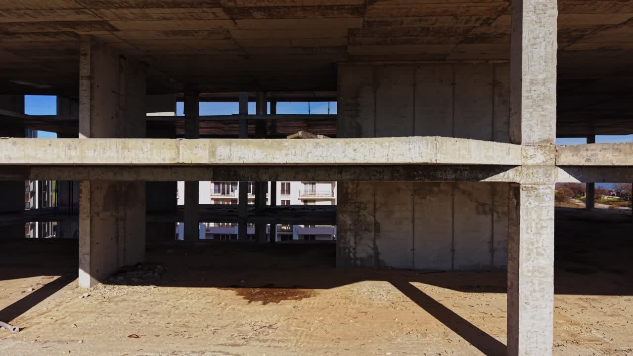 Construction site view of unfinished building structure from above