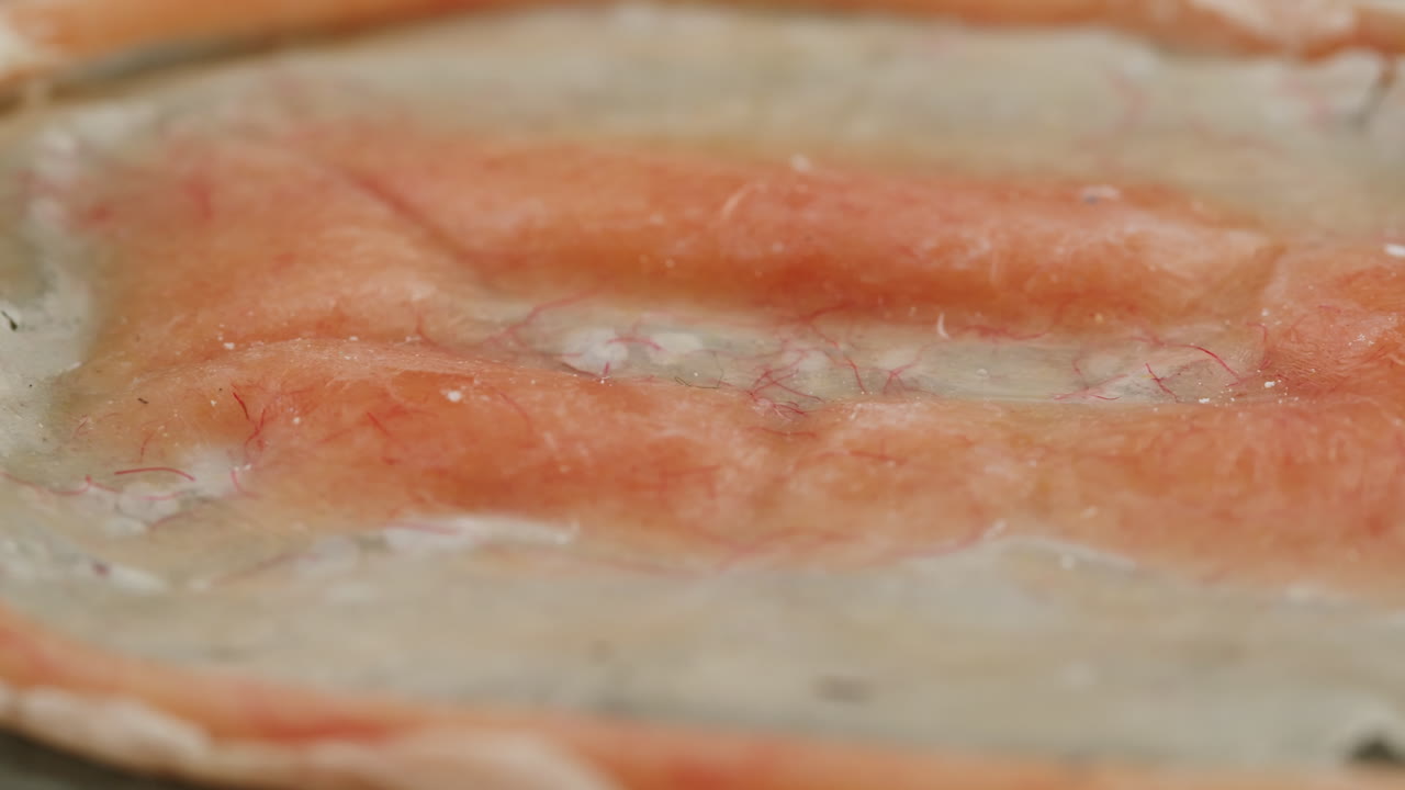 A rubber fake finger with blood close-up. Make-up equipment props for films and shooting. Bloody fake fingers for halloween and parties