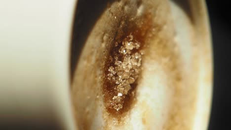 closeup of sugar crystals in a coffee cup