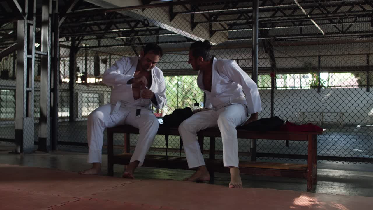 Martial Arts Athletes Resting and Preparing at the Gym