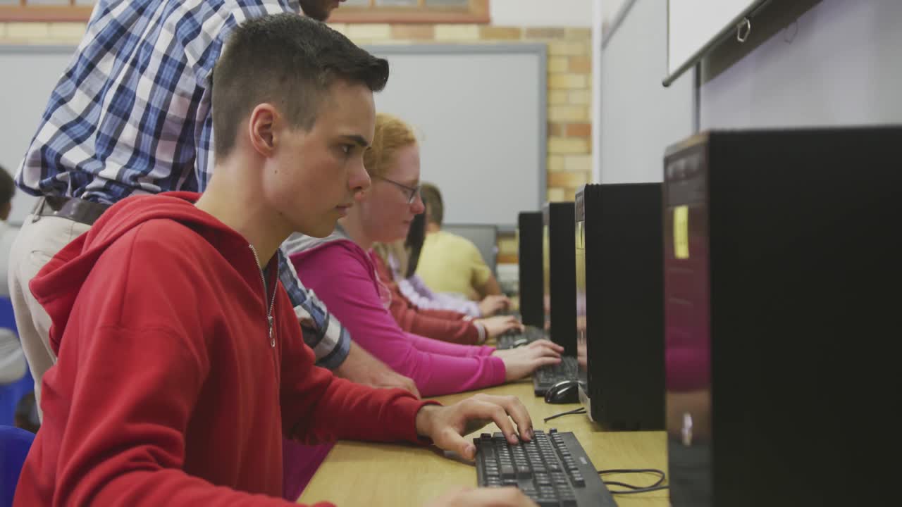 Students working on computers in high school class