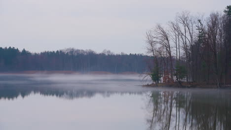 misty morning on lake erie with fog over the water