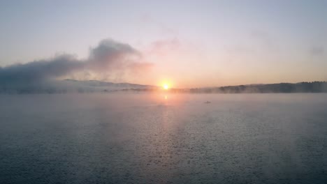 first ray of sunshine over a lake