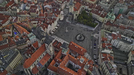 prague czechia aerial v82 birds eye view, drone flyover and around famous old town square capturing crowds at the historic center, tilt up reveals cityscape - shot with mavic 3 cine - november 2022