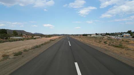 empty runway at a small airfield in a desert landscape