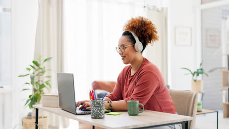 laptop, typing and black woman with headphones