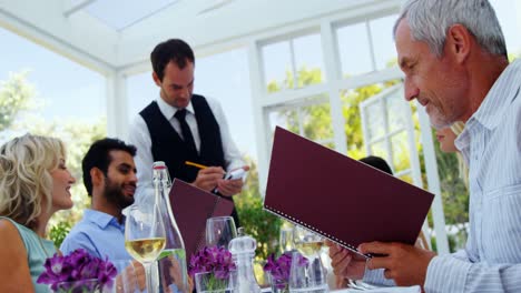 Waiter-taking-an-order-from-customers