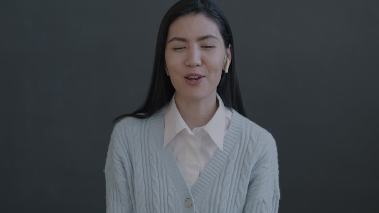 Woman Smiling and Speaking