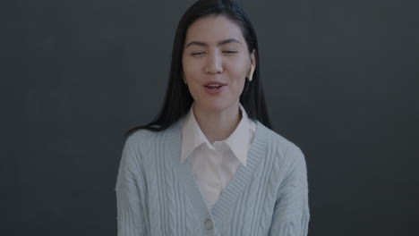 woman smiling and speaking