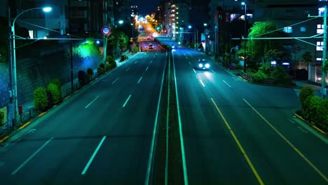a night timelapse of the traffic jam at the downtown street in tokyo wide shot