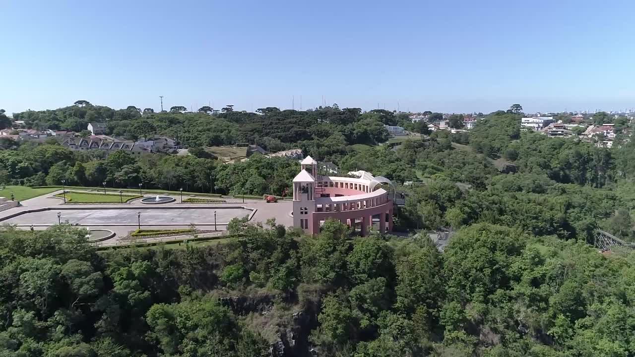 Wide aerial drone shot of Tanguá park in Curitiba Brazil waterfall