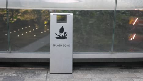 a "splash zone" sign with a water droplet and splash icon