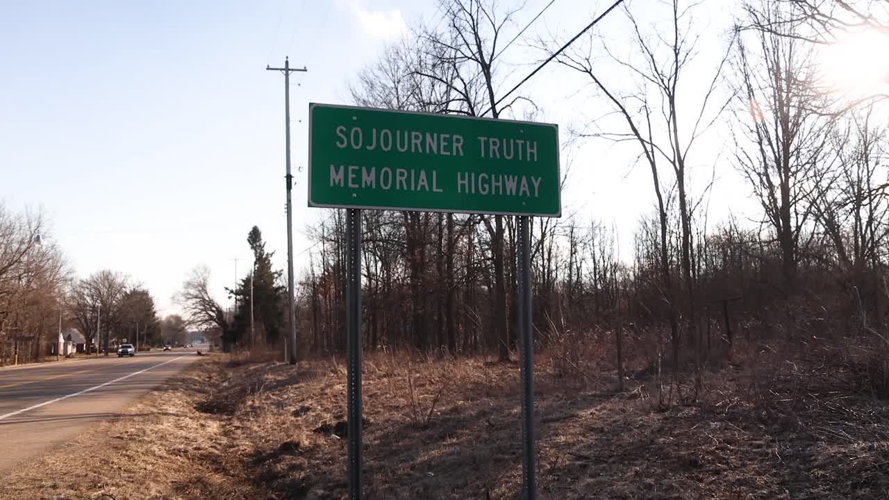 Sojourner Truth memorial highway sign in Battle Creek, Michigan. Stable video.